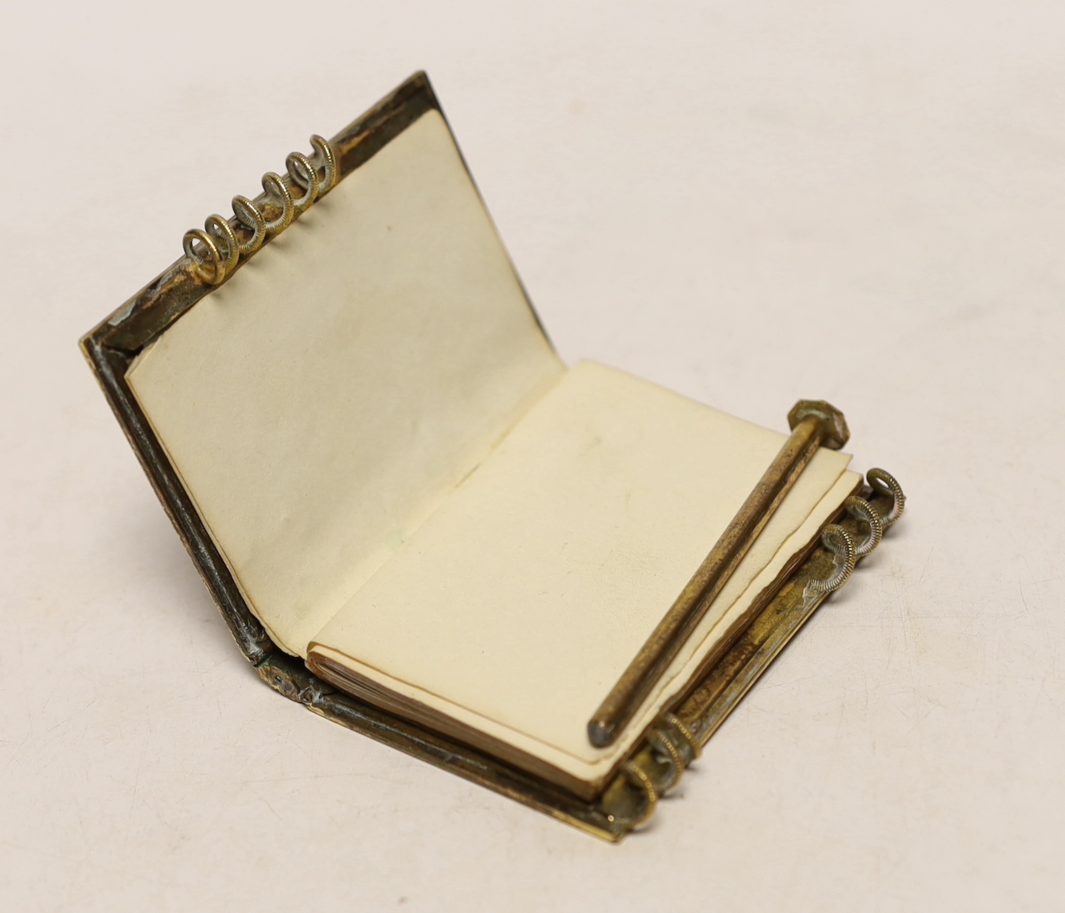 A gilt metal and mother of pearl mounted aide memoire, 7cm high